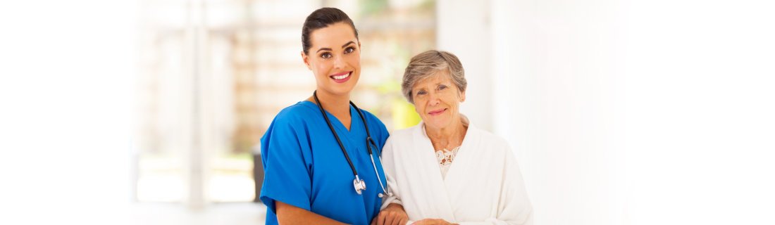 elderly woman and her caregiver